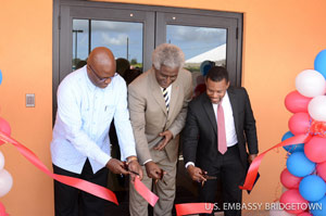 The Honorable Dr. Larry Palmer, United States Ambassador to Barbados, the Eastern Caribbean, and the OECS; the Honorable Adriel Brathwaite, Attorney General and Minister of Home Affairs of Barbados; and Mr. Ronald Jackson, Executive Director of CDEMA partake in a ribbon-cutting ceremony to inaugurate CDEMA’s new regional facility