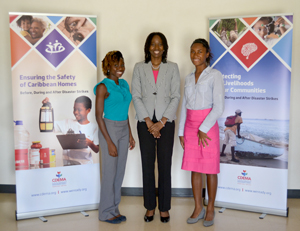 The Students, Ms Florence Fields (l) and Ms Emma Sealy (r) pose for a photograph with Ms Elizabeth Riley, DED CDEMA. 