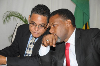 Executive Director, CDEMA, Ronald Jackson in discussion with The Honourable Noel Arscott, Minister of Local Government and Community Development at the Launch of the 8th Annual Conference for Comprehensive Disaster Management at the Spanish Court Hotel, Kingston Jamaica, on Wednesday September 4, 2013