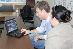 Dr. Zoran Vojinovic showing computer models of work done in St. Maarten