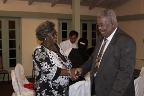 Premier O'Neal congratulates Judy Thomas after she received a long-service award last evening. Thomas has been the Director of Barbados' Emergency Services for 28 years.